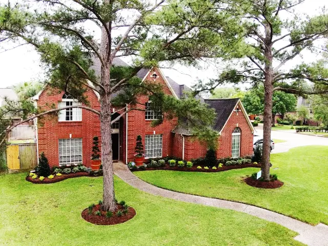Aerial view of a Trophy-landscaped front yard