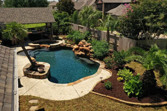 Lagoon pool tucked into layered planting