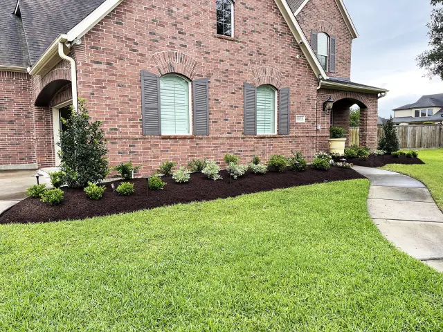 Deep-green lawn with clean walk edges