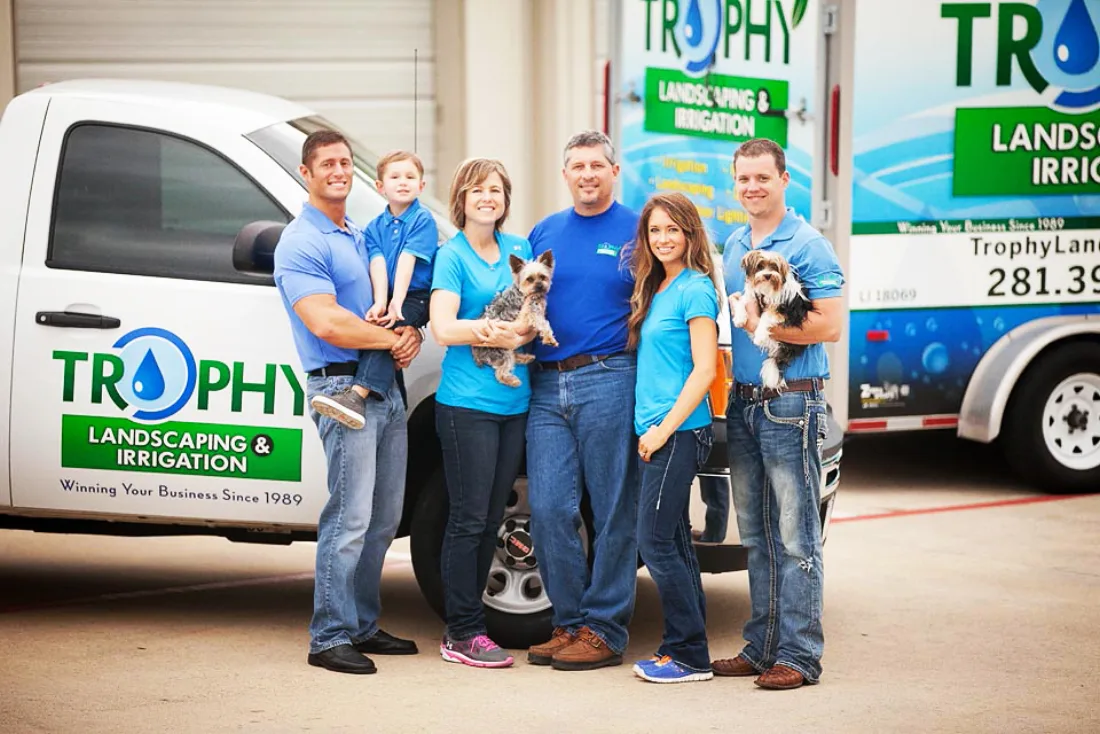 The Trophy Landscaping & Irrigation family and crew in front of the company truck