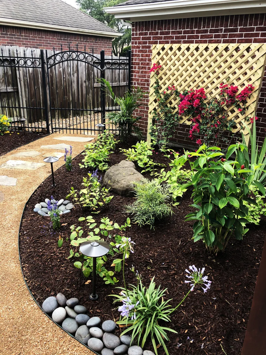 Landscape lighting installed by Trophy in a Katy garden bed