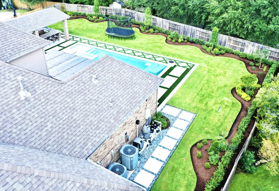 Backyard irrigation and equipment area serviced by Trophy